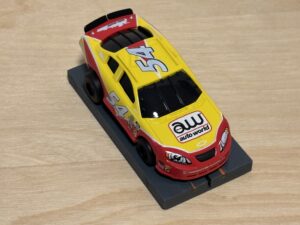 Auto World Super III Nascar #54 gelb/rot