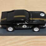 Johnny Lightning Shelby Mustang schwarz/gold #1 mit BDR Chassis