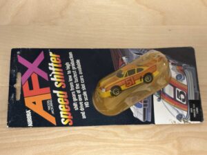 Aurora AFX Speed Shifter Porsche 934 Turbo gelb/orange No. 51 auf Original-Blister