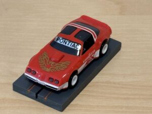 Tomy AFX Pontiac Firebird rot mit Bulldog-Chassis