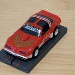 Tomy AFX Pontiac Firebird rot mit Bulldog-Chassis