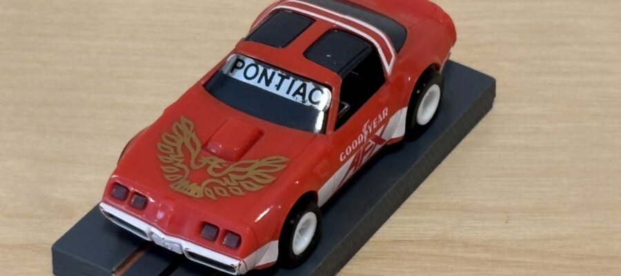 Tomy AFX Pontiac Firebird rot mit Bulldog-Chassis