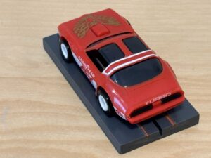 Tomy AFX Pontiac Firebird rot mit Bulldog-Chassis