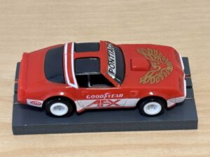 Tomy AFX Pontiac Firebird rot mit Bulldog-Chassis