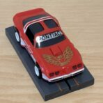 Tomy AFX Pontiac Firebird rot mit Bulldog-Chassis