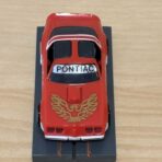 Tomy AFX Pontiac Firebird rot mit Bulldog-Chassis