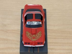 Tomy AFX Pontiac Firebird rot mit Bulldog-Chassis