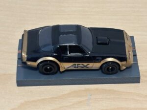 Tomy AFX Pontiac Firebird schwarz "AFX" mit Bulldog-Chassis